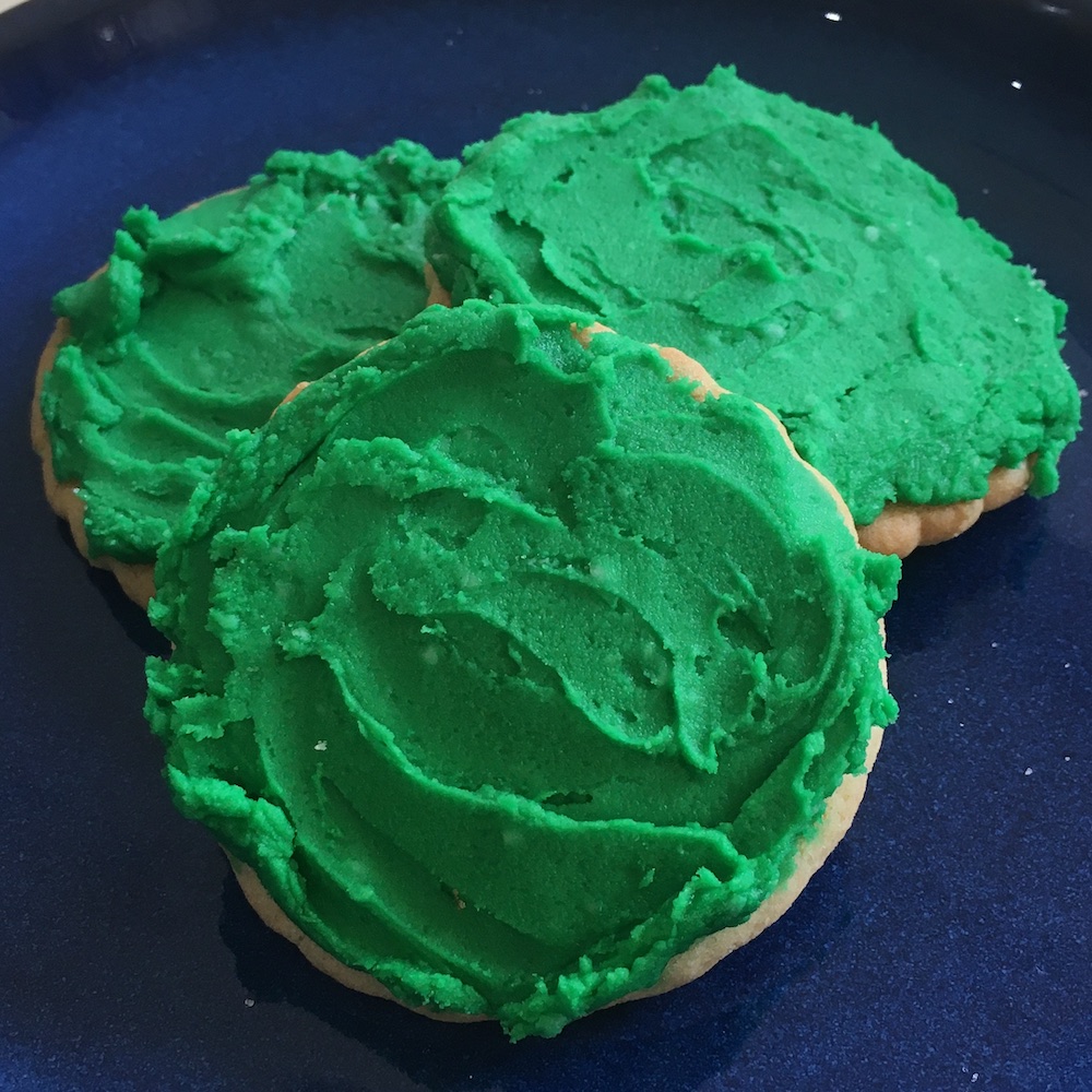 three green sugar cookies square