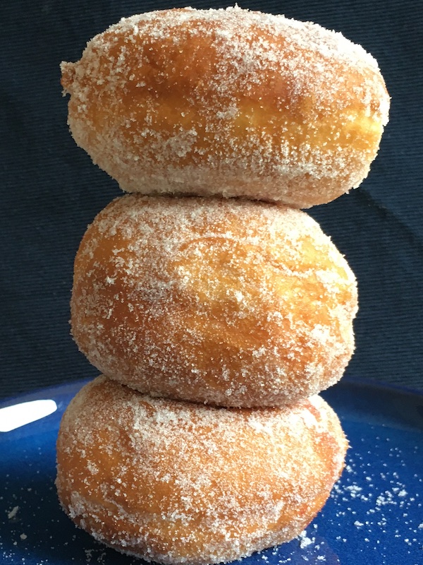 stack of three jam donuts